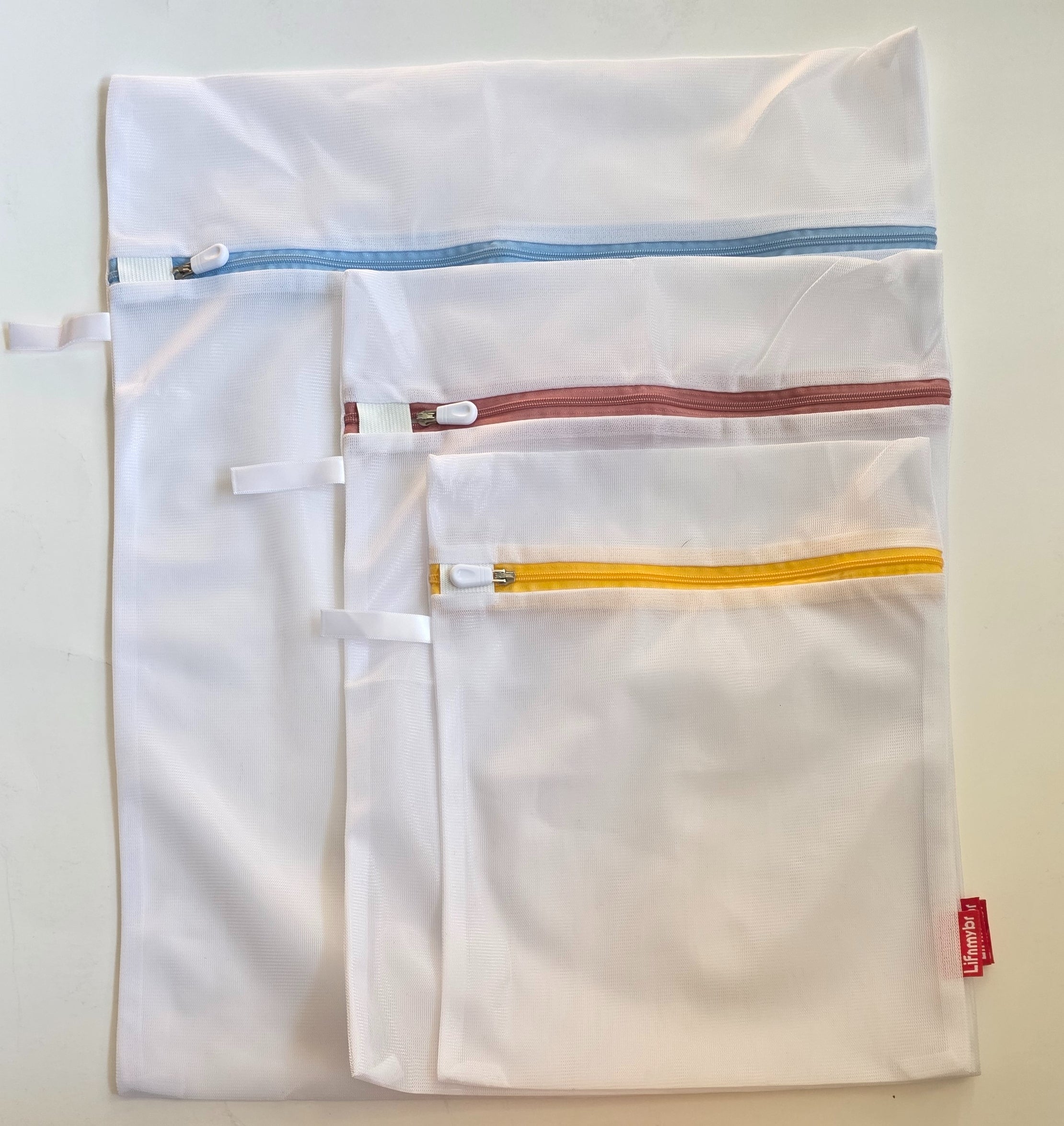 Perfect Choice mesh laundry bags in small, medium and large sizes with color-coded zippers